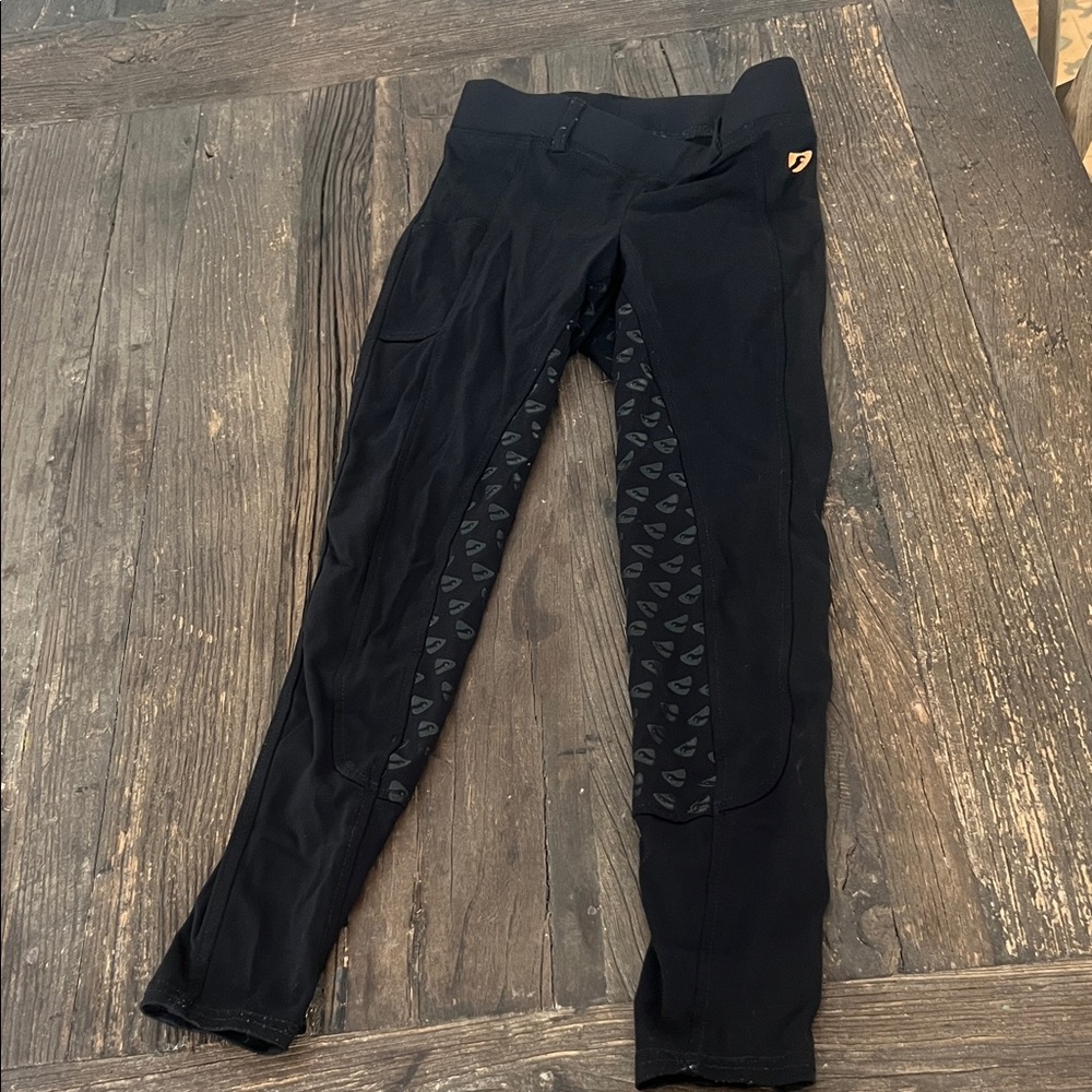 Black equestrian riding bridges with grip detail and pocket